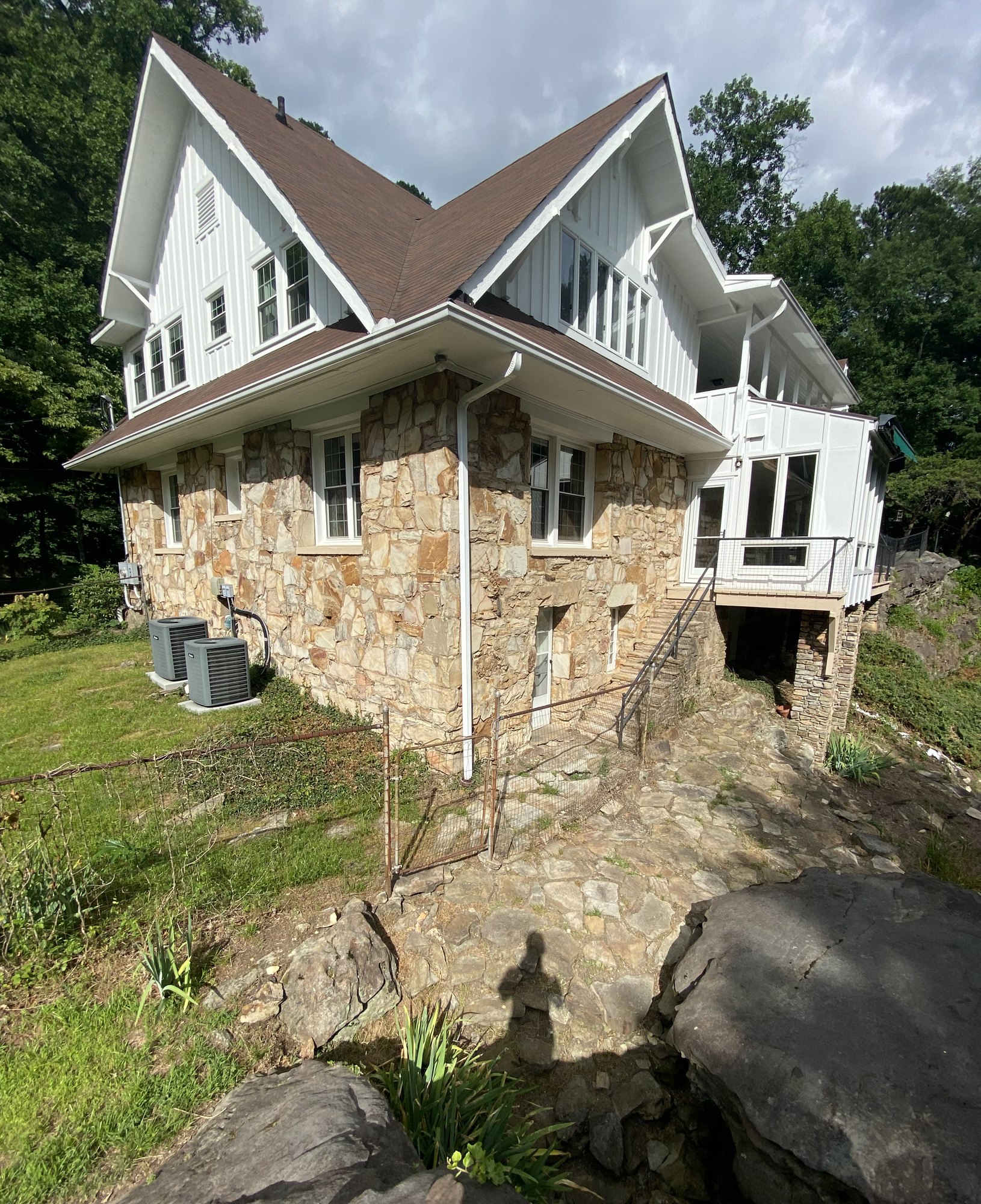 The 1925 stone cottage on the mountain, daytime