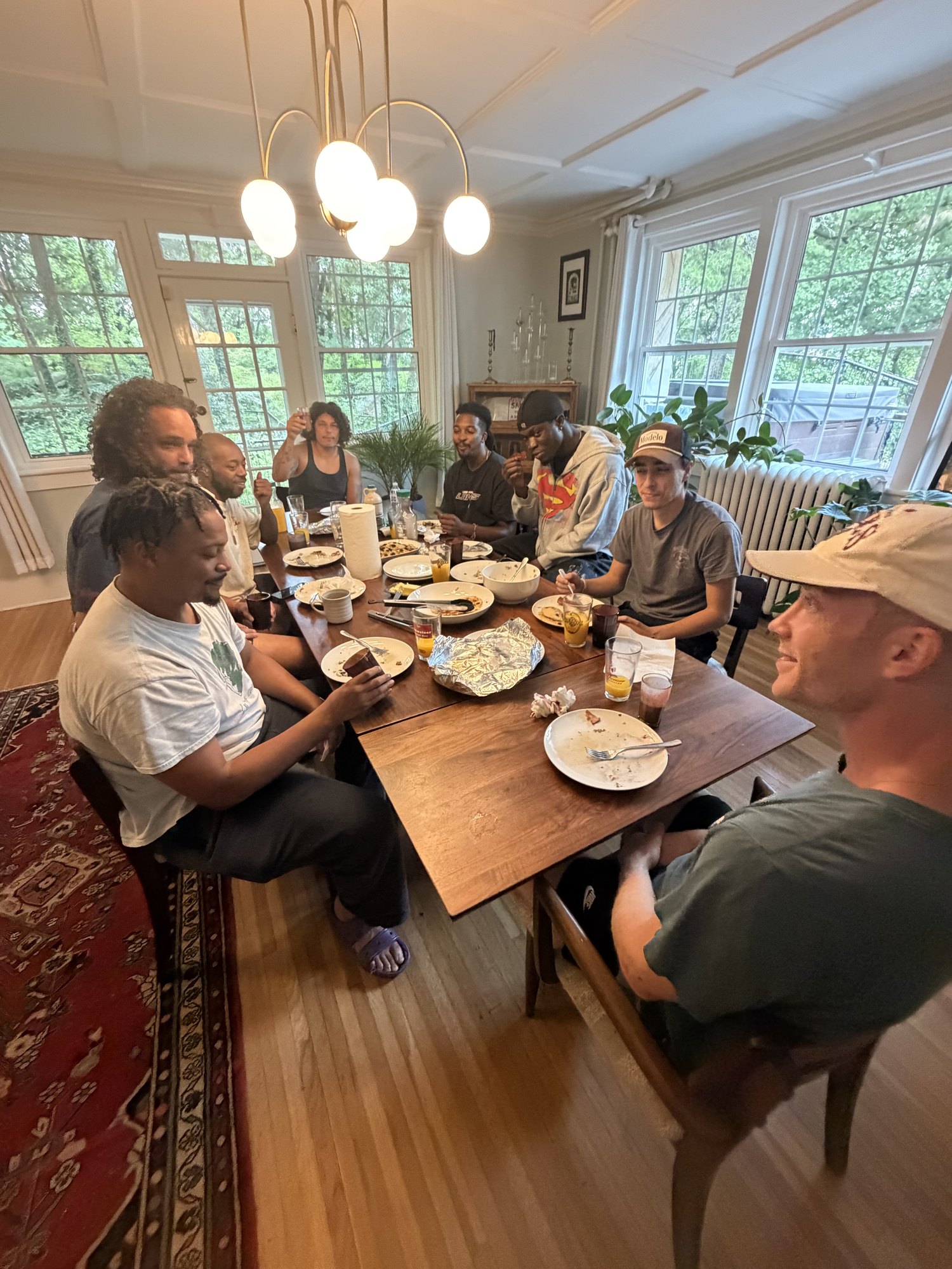 Guests eating together at the MOTM dining table