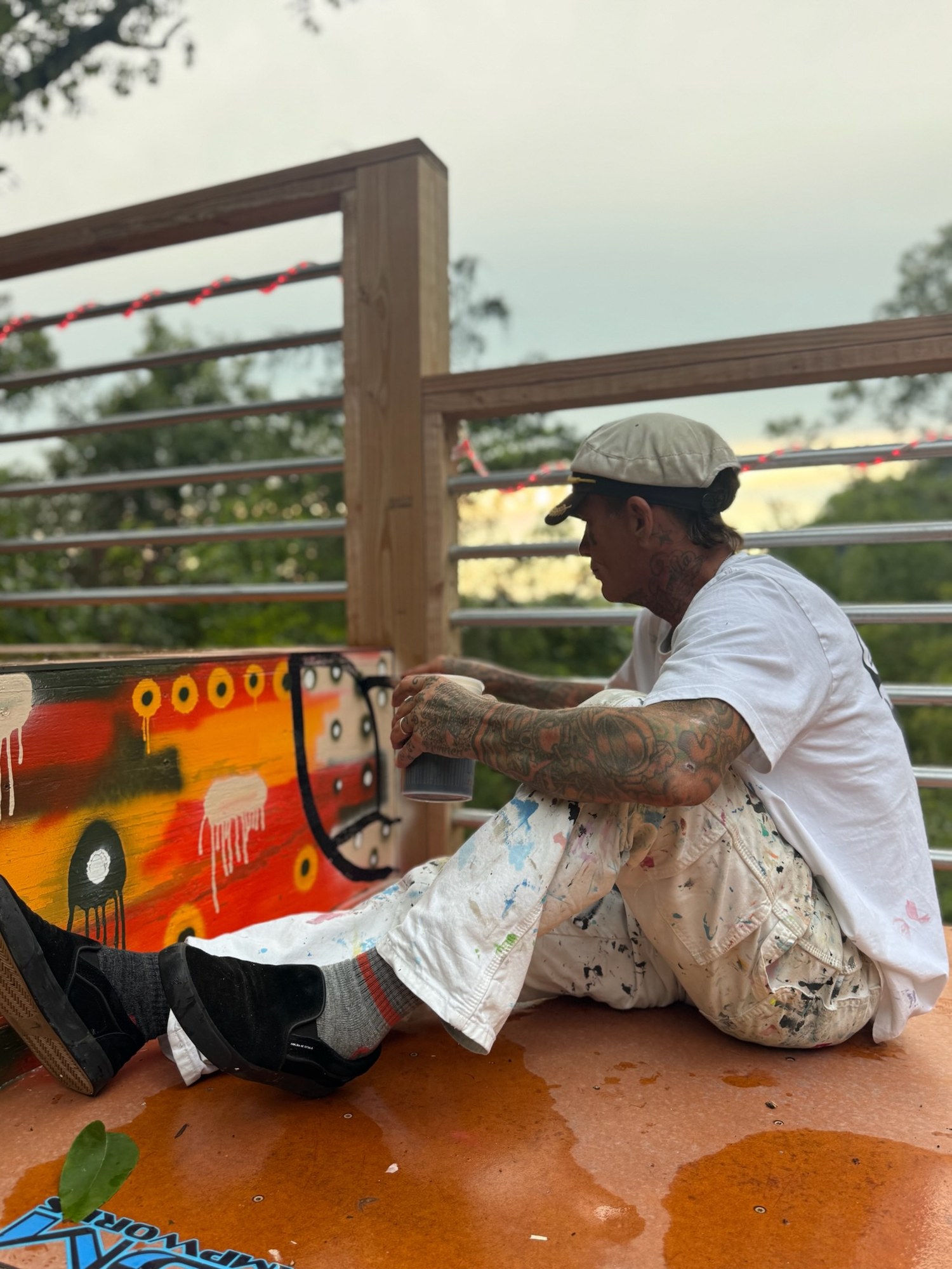 Kris sitting on the ramp deck after painting