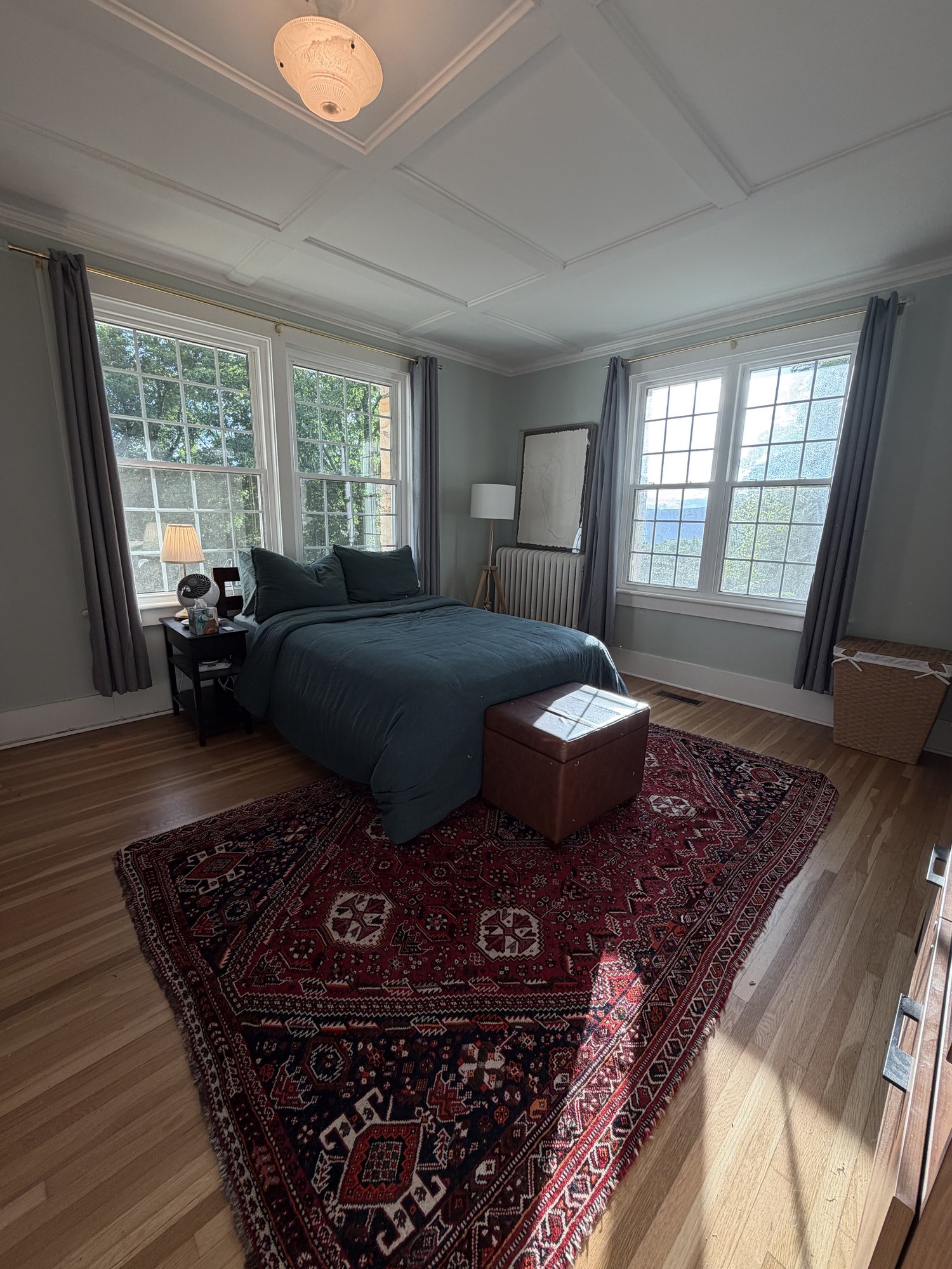 Bedroom with a persian rug and mountain view windows